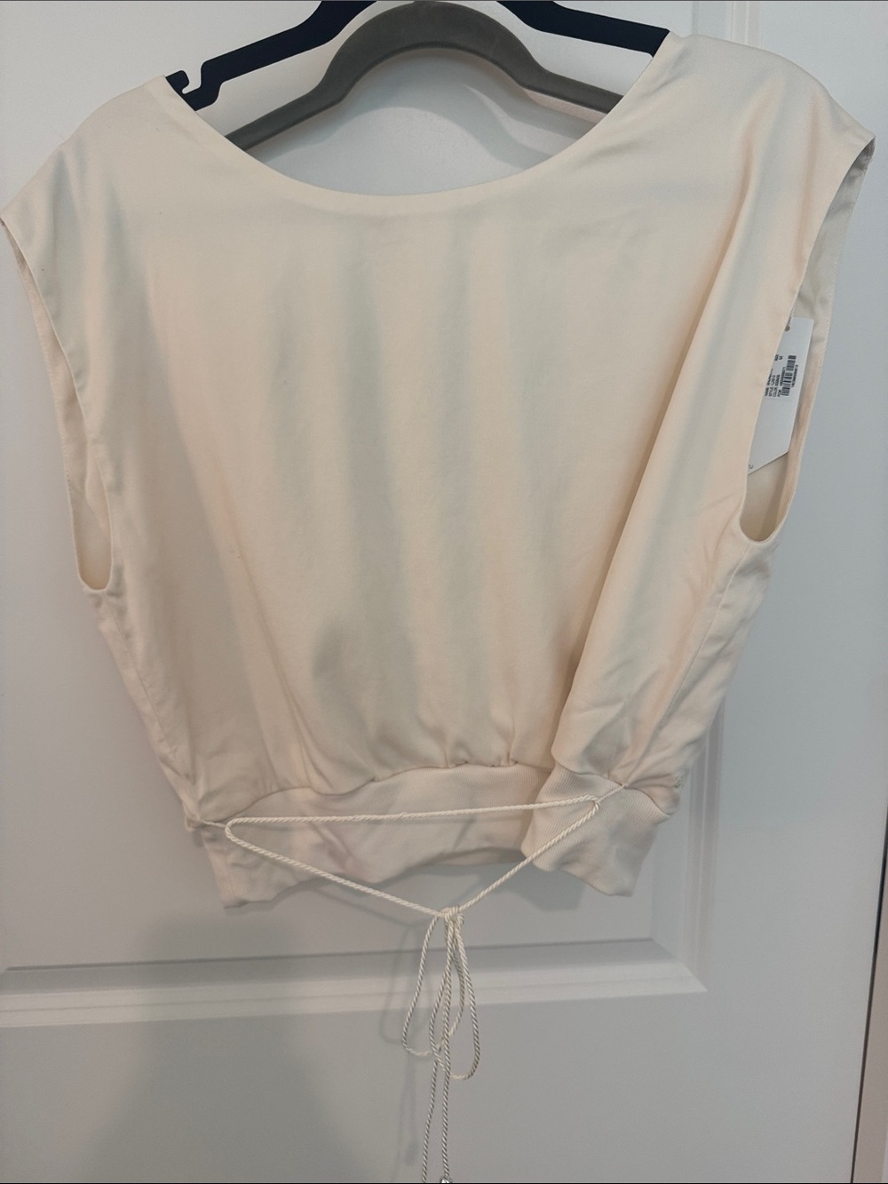 Travis Matthew's Shoreline Sleeveless Drawcord Crop Top in Cream